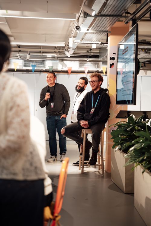 Guest speakers sharing ideas in an informal creative-space discussion