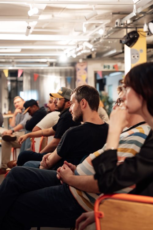 Participants listening and exchanging ideas at an informal salon